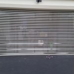white aluminum shutter door